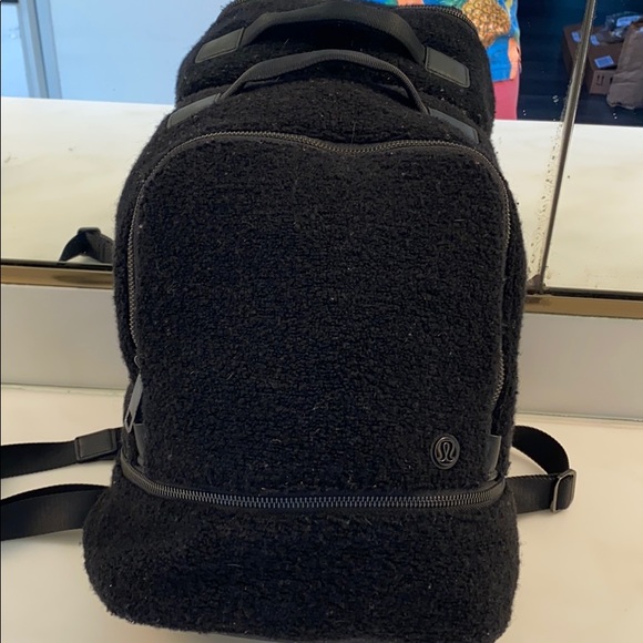 Lululemon mini backpack measures about 14 by 12,13